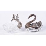 TWO GLASS TABLE SALTS WITH WHITE METAL FITTINGS. MODELLED AS A DOLPHIN AND A SWAN. 7cm x 7cm x 4cm