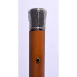 AN ANTIQUE SILVER MOUNTED MALACCA WALKING CANE. 80 cm long.