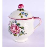 Mid-18th century Mennecy custard cup and cover with swirl moulding painted with flowers, the cup inc