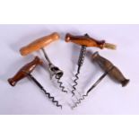 FOUR ANTIQUE CORKSCREWS with wood handles. Largest 12 cm x 9 cm. (4)