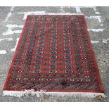 A PERSIAN RUG. 180 cm x 128 cm.