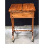 A fine Regency two drawer writing table with folding top and castors. 77 x 52 x 47 cm