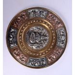 A LATE 19TH CENTURY INDIAN SILVER AND COPPER REPOUSSE DISH decorated with buddhistic figures. 21 cm