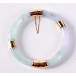 A CHINESE GOLD AND JADE BANGLE. 6 cm diameter.