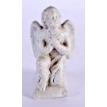 AN 18TH/19TH CENTURY EUROPEAN PORCELAIN FIGURE OF A WINGED BOY. 7.5 cm x 3 cm.