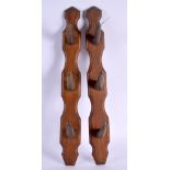 A PAIR OF 19TH CENTURY MIDDLE EASTERN CARVED HORN COAT RACKS upon wooden plinths. 50 cm long.