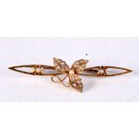 A VICTORIAN 15CT GOLD PEARL BROOCH. 3.5 grams. 5 cm x 1.25 cm.