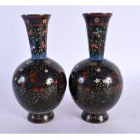 A FINE PAIR OF 19TH CENTURY JAPANESE MEIJI PERIOD CLOISONNE ENAMEL VASES decorated with foliage on a