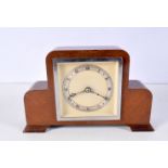 An Art Deco wooden framed mantle clock 14 x 22 cm.