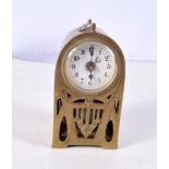A small Successionist movement brass carriage clock with porcelain face 11 cm.