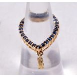 A 14CT GOLD AND SAPPHIRE PENDANT. 2.3 grams. 3 cm x 1.75 cm.