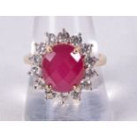 A 9CT GOLD, CZ AND RED GEM RING. Stamped 9K, Size R, weight 5.7g