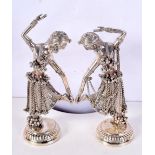 A PAIR OF VINTAGE MIDDLE EASTERN INDIAN SILVER FIGURES OF DANCERS. 612 grams. 23 cm high.