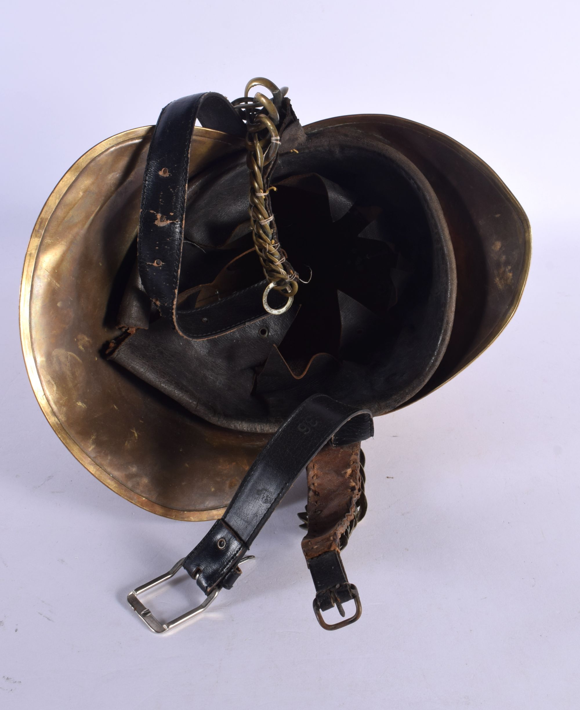 AN ANTIQUE FIREMANS HELMET. 24 cm x 20 cm. - Image 4 of 4