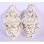A PAIR OF 19TH CENTURY CONTINENTAL BLANC DE CHINE WALL POCKETS encrusted with flowers. 15 cm x 7 cm.