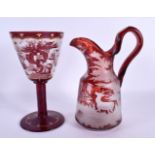 A LARGE BOHEMIAN RUBY GLASS JUG together with a similar chalice Largest 25 cm high. (2)