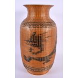A CHINESE REPUBLICAN PERIOD WICKER OVERLAID PORCELAIN VASE. 24 cm high.