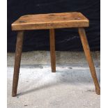 An antique wooden Cutler's stool 41 x 39 cm .