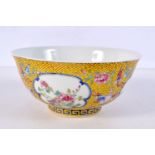 A Chinese porcelain Famille Jeune bowl decorated with flowers in panels 8 x 13 cm diameter.