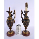 A PAIR OF 19TH CENTURY EUROPEAN GRAND TOUR COUNTRY HOUSE BRONZE LAMPS formed as ewers. 39 cm high.