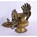 AN UNUSUAL 18TH/19TH CENTURY INDIAN BRONZE HOLY OIL VESSEL formed with Ganesha behind a flaming term