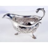 A LATE VICTORIAN SILVER REPOUSSE SAUCE BOAT by George & Nathan Ridley. Chester 1894. 268 grams. 18 c