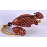 A JAPANESE CARVED BOXWOOD FISH INRO with netsuke. Inro 11.5 cm x 5.75 cm.
