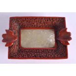 AN EARLY 20TH CENTURY CHINESE CINNABAR LACQUER OVERLAID JADE TABLET Late Qing/Republic. 12 cm x 7.5