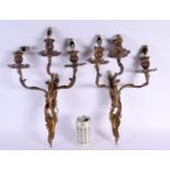 A PAIR OF VINTAGE COUNTRY HOUSE GILT METAL TRIPLE BRANCH CANDLE WALL SCONCES. 46 cm x 24 cm.