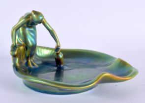 A 1930 HUNGARIAN ZSOLNAY PECS IRIDESCENT PORCELAIN FIGURAL DISH. 16 cm wide.