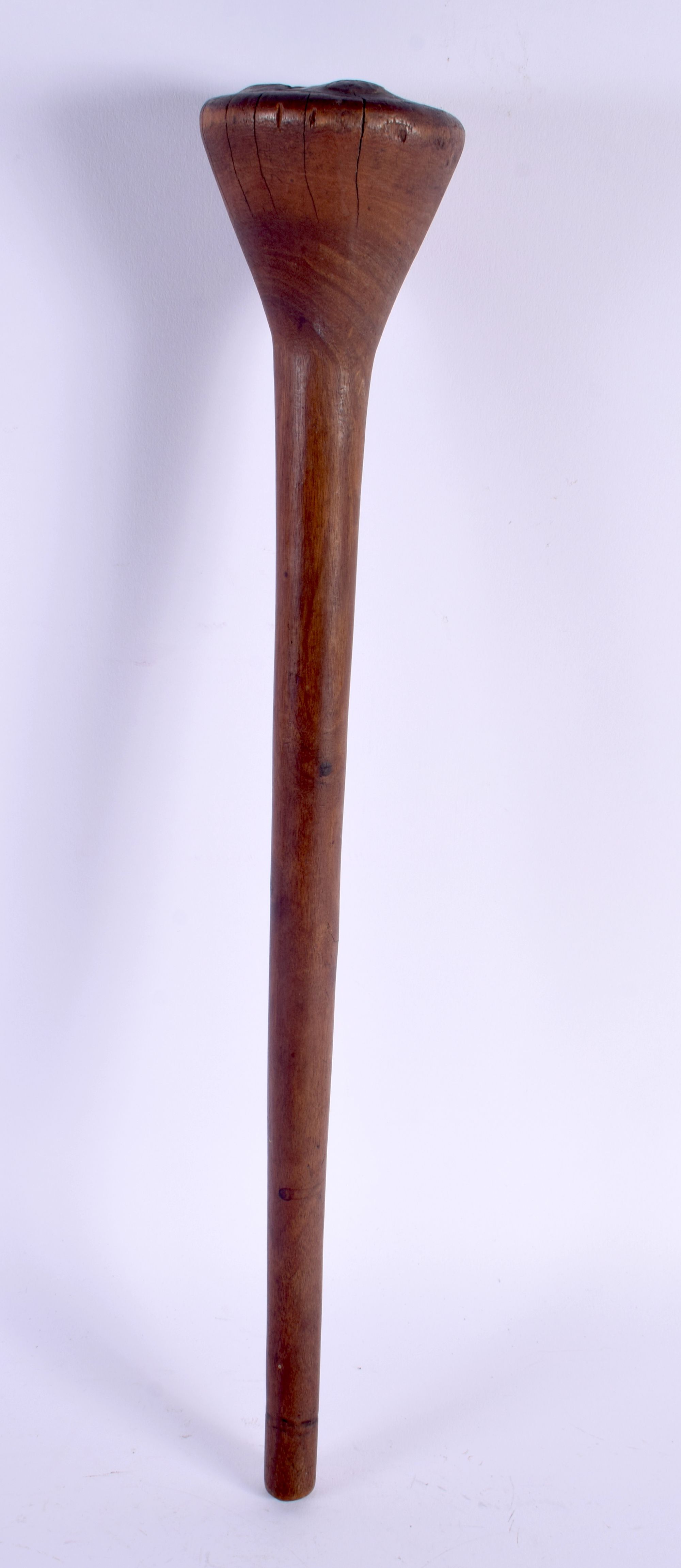 AN EARLY 20TH CENTURY TRIBAL CARVED WOOD THROWING CLUB with dimpled terminal. 47 cm long.