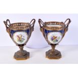 A PAIR OF 19TH CENTURY FRENCH SEVRES PORCELAIN VASES mounted in bronze. 21 cm x 14 cm.