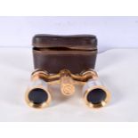 A pair of cased Constellation Mother of pearl and gilt metal opera glasses 10 cm.