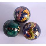 THREE UNUSUAL CLOISONNE ENAMEL BELL BALLS. 5 cm diameter. (3)