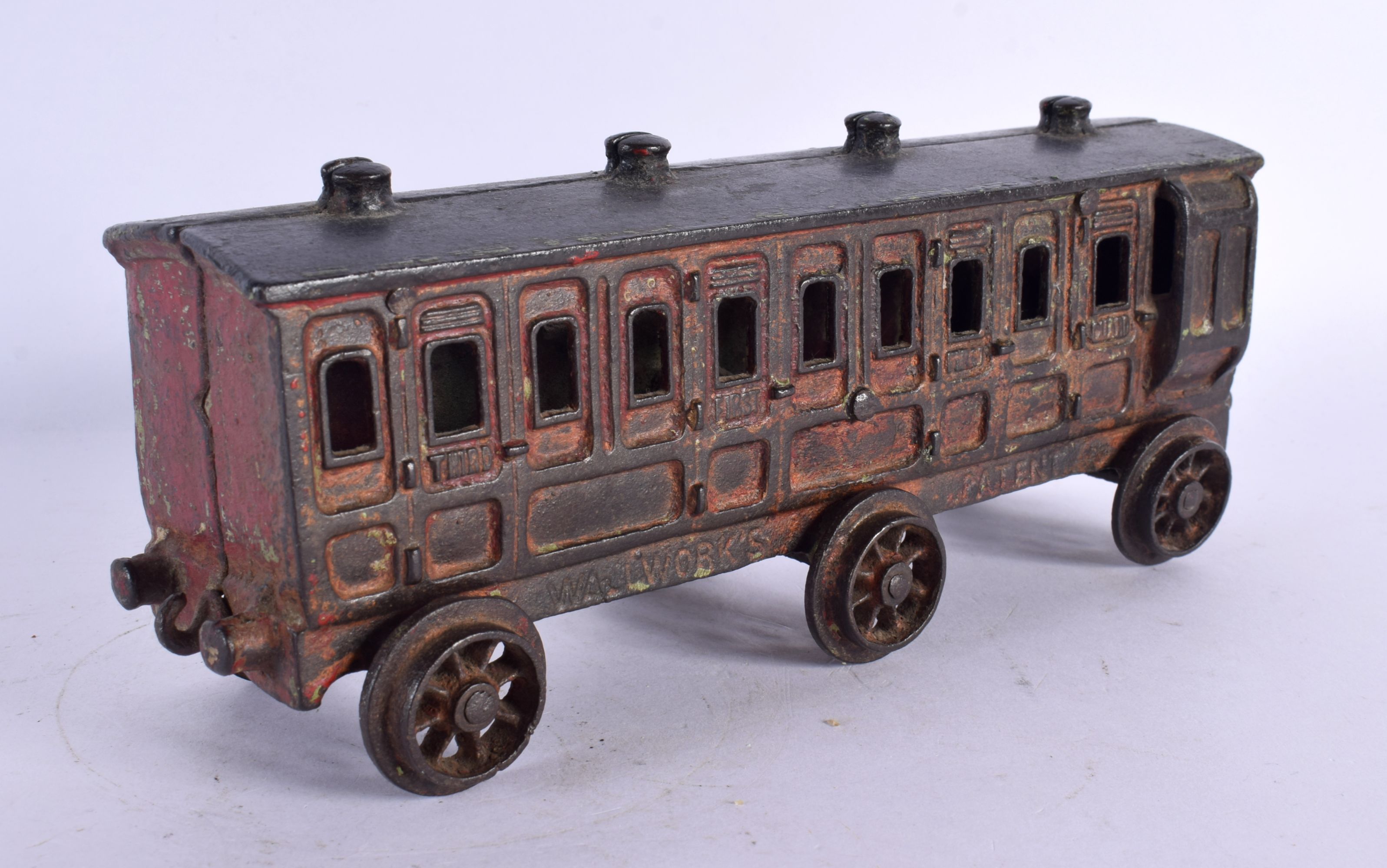 AN ANTIQUE WALLWORKS PATENT CAST IRON TRAIN CARRIAGE. 22 cm wide.