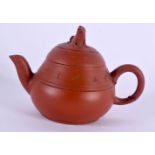 A RARE MINIATURE LATE 19TH/20TH CENTURY CHINESE YIXING POTTERY TEAPOT AND COVER decorated with calli