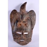 A SOUTH AMERICAN TRIBAL POTTERY MASK. 33 cm x 15 cm.