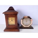 A wooden mantle clock together with an Art Deco mirrored surround clock largest 35 cm. (2)