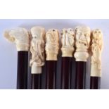 SIX CONTEMPORARY CARVED BONE WALKING CANES. 90 cm long. (6)