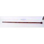 A stylish wooden faceted inlaid walking cane. 99cm.