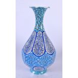A MIDDLE EASTERN ISLAMIC ENAMELLED VASE decorated with foliage and vines. 22 cm high.
