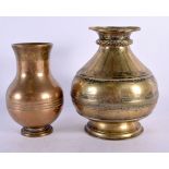 AN 18TH CENTURY MIDDLE EASTERN INDIAN BRONZE VESSEL together with a smaller similar vase. Largest 17