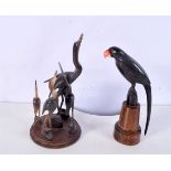 A carved horn sculpture of cranes together with a carved horn bird on a plinth largest 19 cm (2).