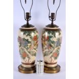 A LARGE PAIR OF EARLY 20TH CENTURY JAPANESE MEIJI PERIOD SATSUMA LAMPS painted with birds and landsc