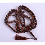 A STRING OF MIDDLE EASTERN ISLAMIC RELIGIOUS BEADS. 160 cm long.