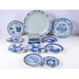 A collection of Chinese porcelain blue and white plates some 18th Century together with a stand larg