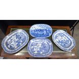 A RARE ANTIQUE BLUE AND WHITE DRAINING DISH and three platters. Largest 36 cm wide. (4)