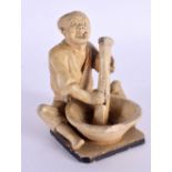 A LATE 19TH CENTURY JAPANESE MEIJI PERIOD POTTERY FIGURE OF A MALE modelled washing clothes. 7 cm x