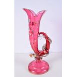 A large ruby glass Cornucopia decorated in relief with flowers and a snake intertwining the handle 3