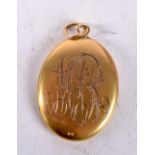 A 10K GOLD LOCKET. 10.4 grams. 3.75 cm x 2.5 cm.